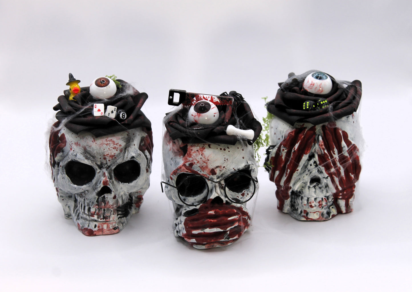 The Unholy Trio skull heads