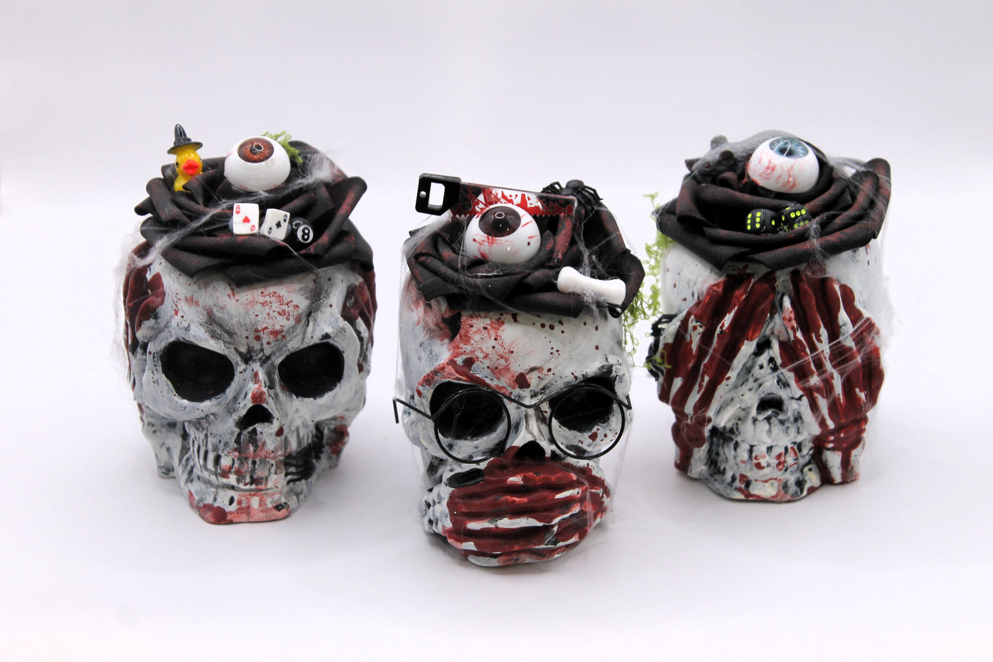 The Unholy Trio skull heads