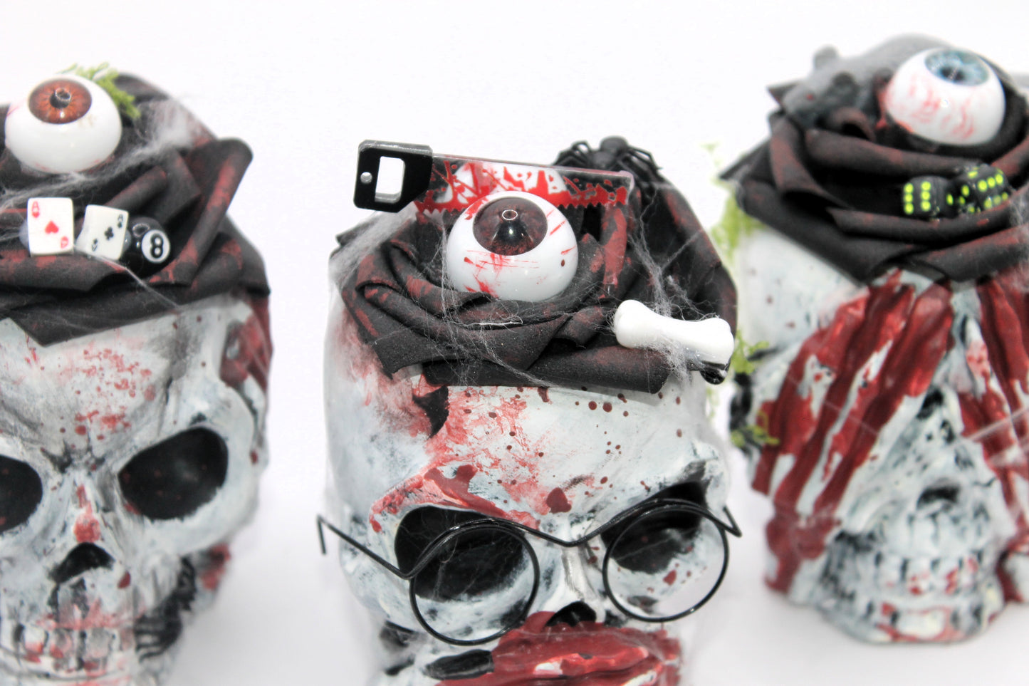 The Unholy Trio skull heads