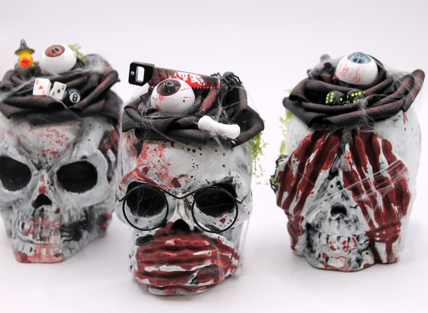 The Unholy Trio skull heads