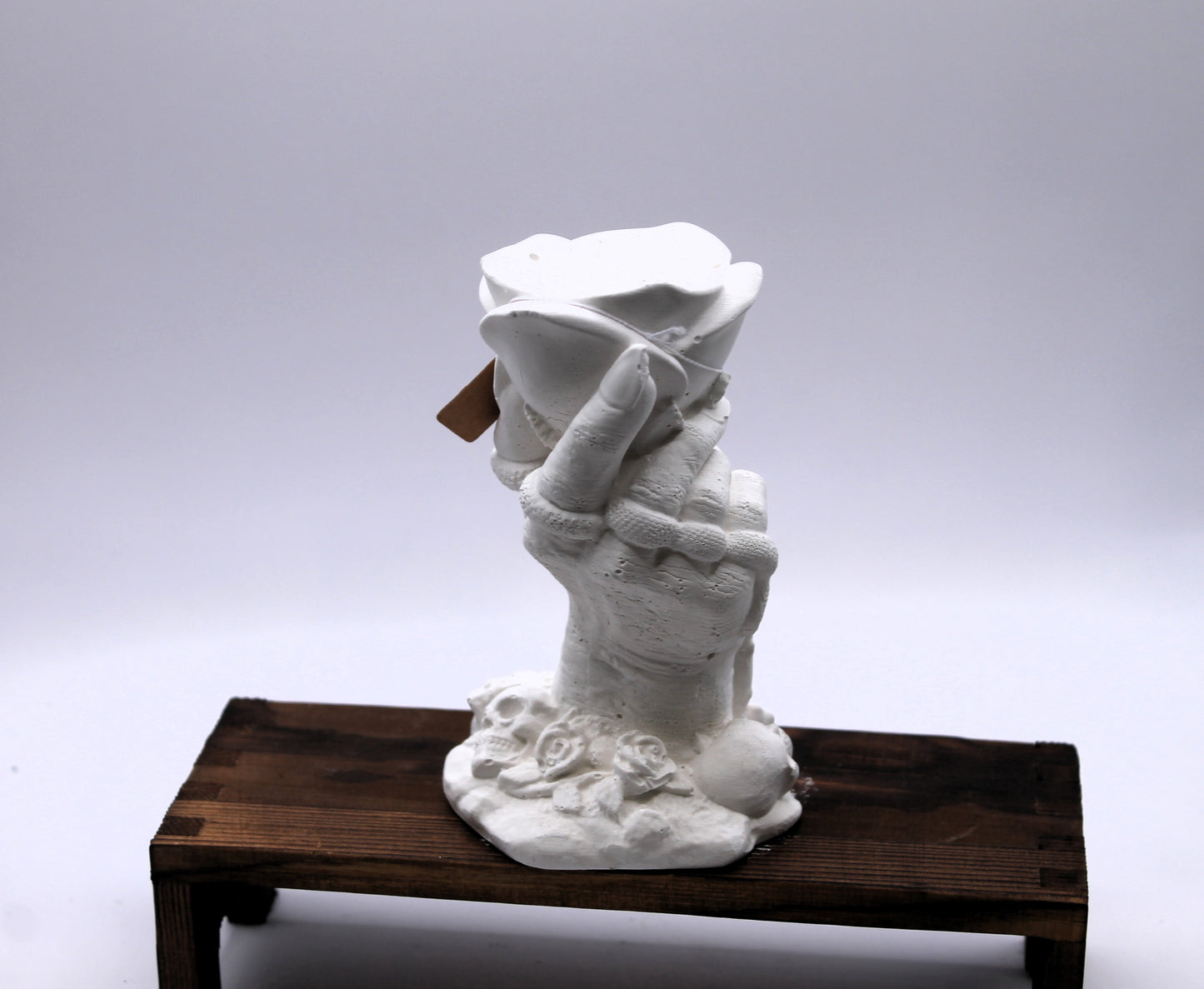 witches hand holding a rose plaster raw mold