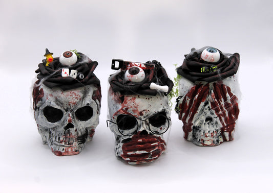 The Unholy Trio skull heads