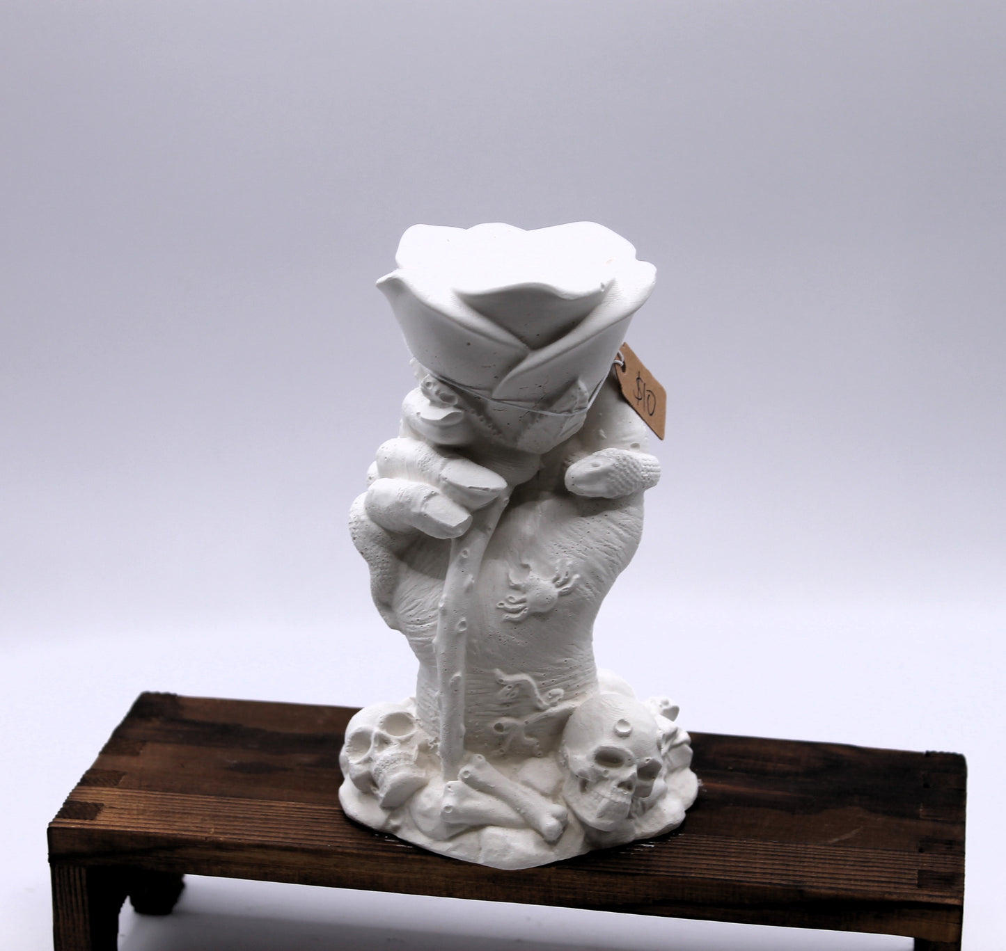 witches hand holding a rose plaster raw mold